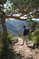 06-3209 Hill Walker Enjoying the View to the Village of Payreleau, from the Cliffs of the Gorge de la Jonte, Cevennes National Park, France